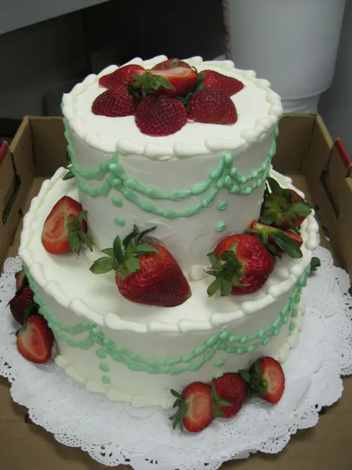 Wedding cake: Fruit #1. Iced in vanilla buttercream.