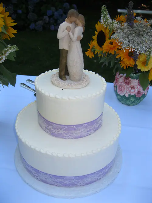 Wedding cake: Ribbon #2. Vanilla buttercream. Ribbon and topper provided by customer.